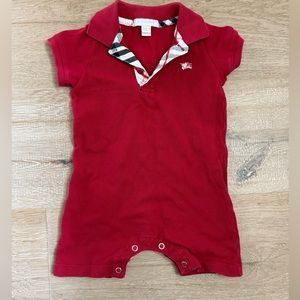 Red romper. Collar & button top. Clasp bottom.